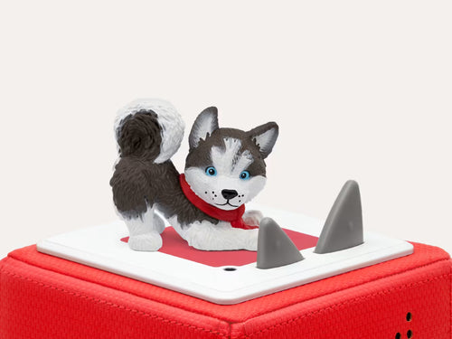Figurine Tonies husky Un Noël magique posée sur une Toniebox rouge