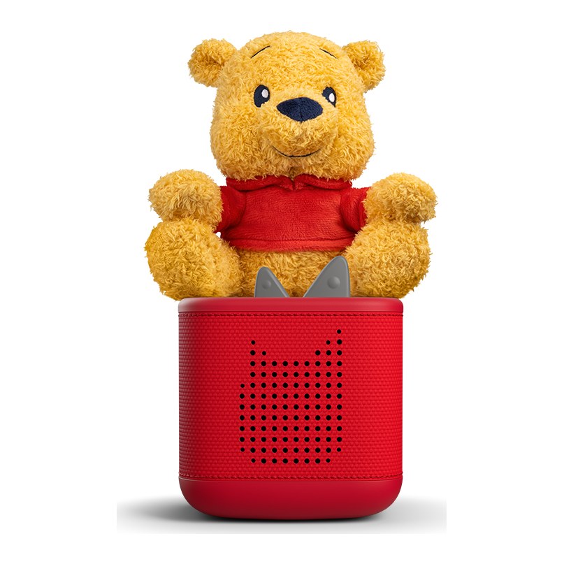 Tonie câlin Winnie l'ourson posé sur une Toniebox rouge